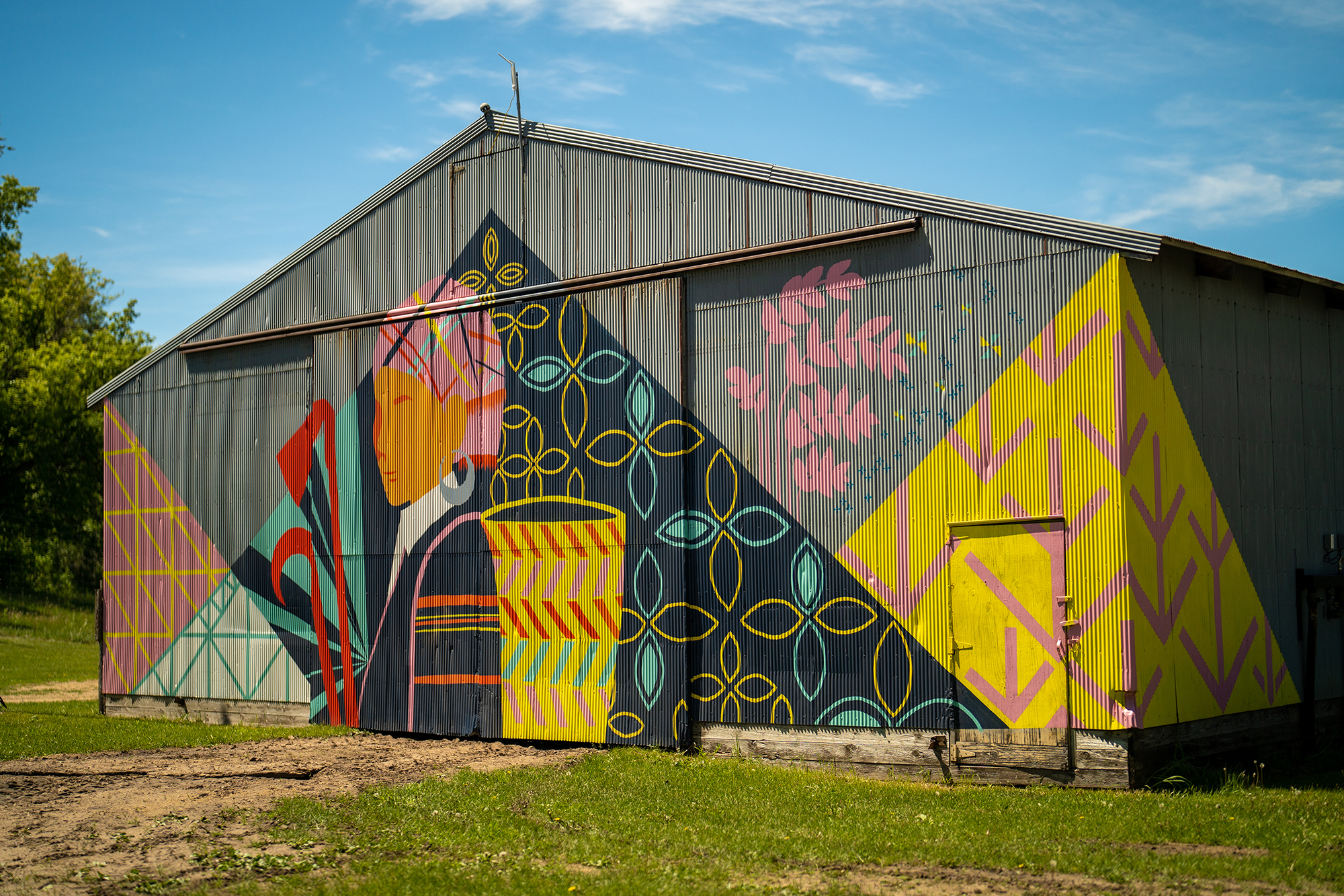 A vibrant mural on a farm building.